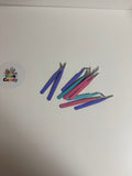 Creative Tweezers in pastelkleuren op witte achtergrond